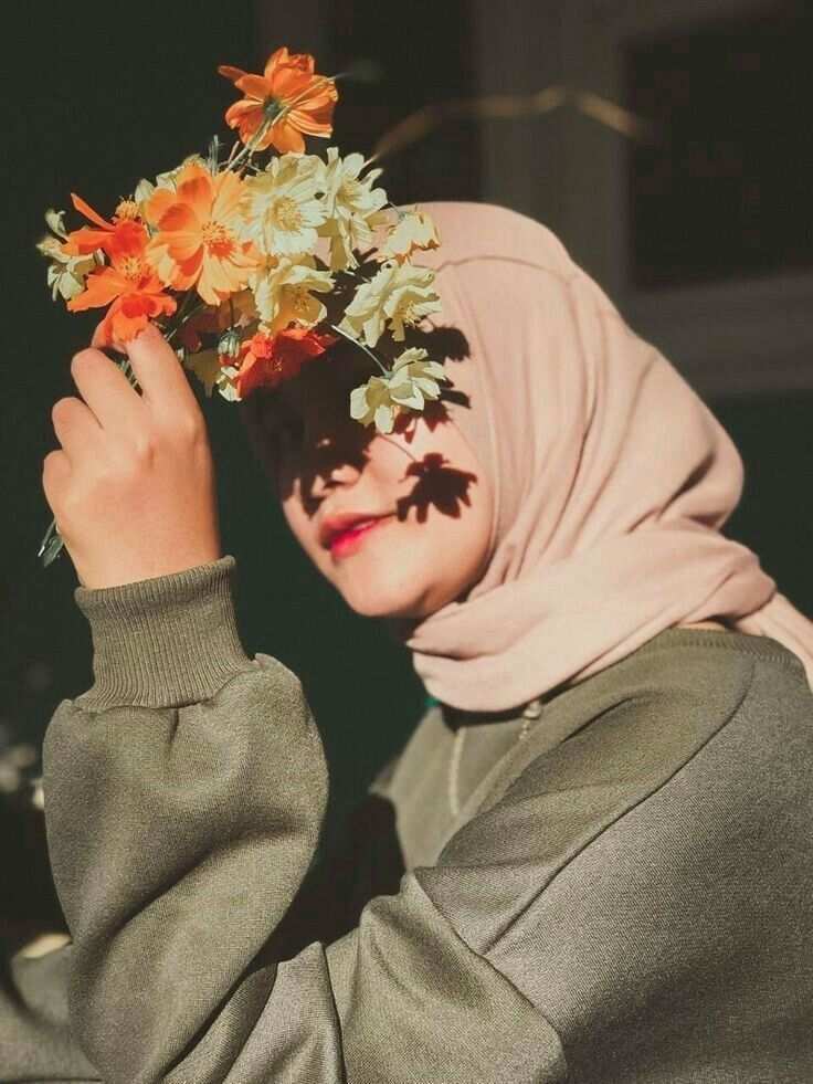 A fashionable women’s scarf displayed on a neutral background, showcasing its intricate pattern and soft.